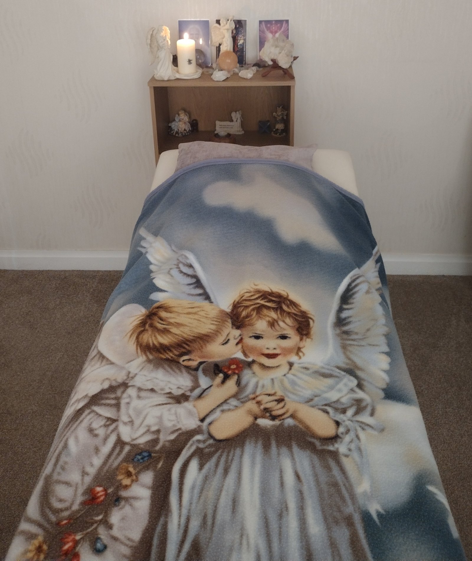 A treatment couch set up for a Reiki treatment
