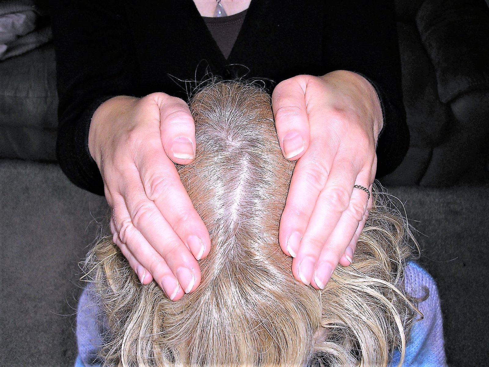 A lady receives hands-on healing
